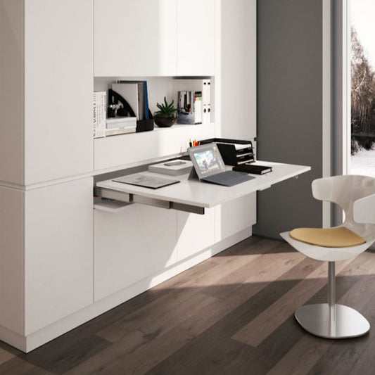 Pull-out peninsula table extending from a drawer compartment.