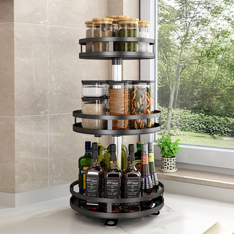 3 Tier height adjustable rotating organizer rack with detachable trays and 360° rotation. Durable BPA-free metal construction with non-slip silicone pads and raised edges for stable and secure storage of spices, condiments, and other items. Dimensions: 26x26x56 cm.