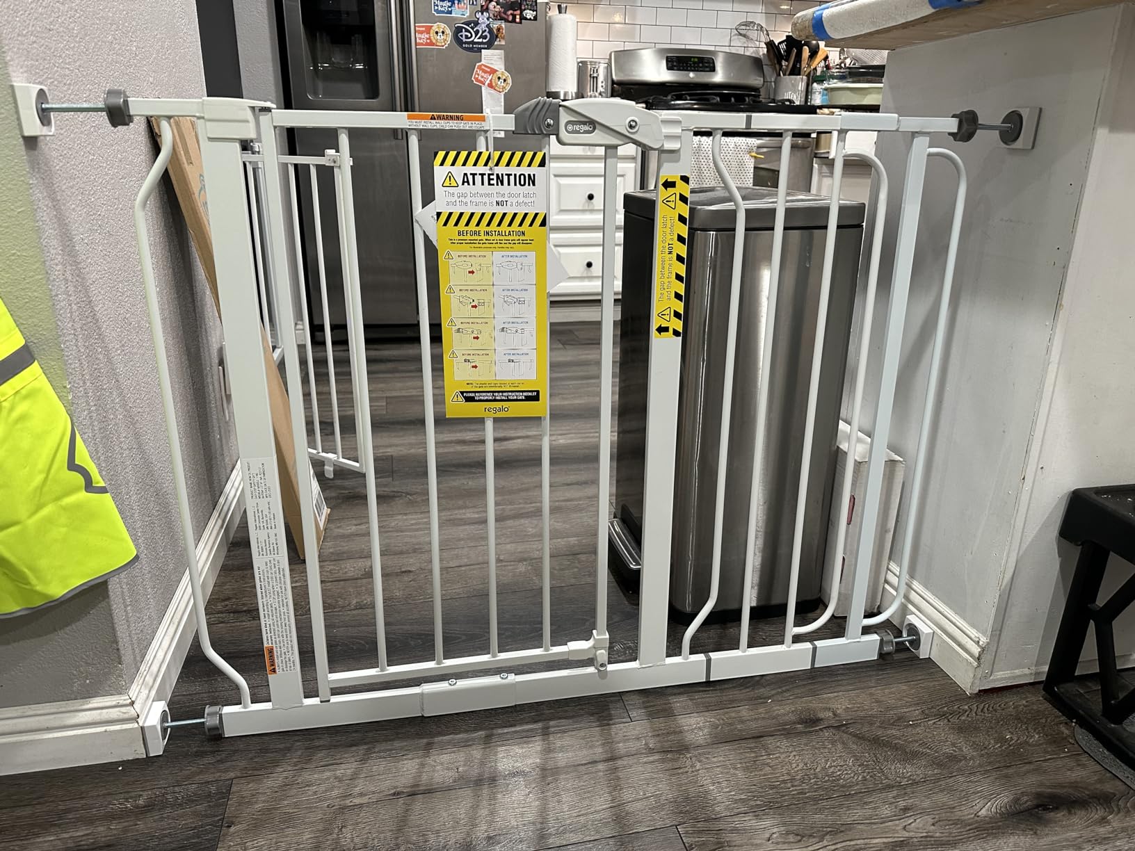 Adjustable baby gate installed in a doorway to keep the baby safe