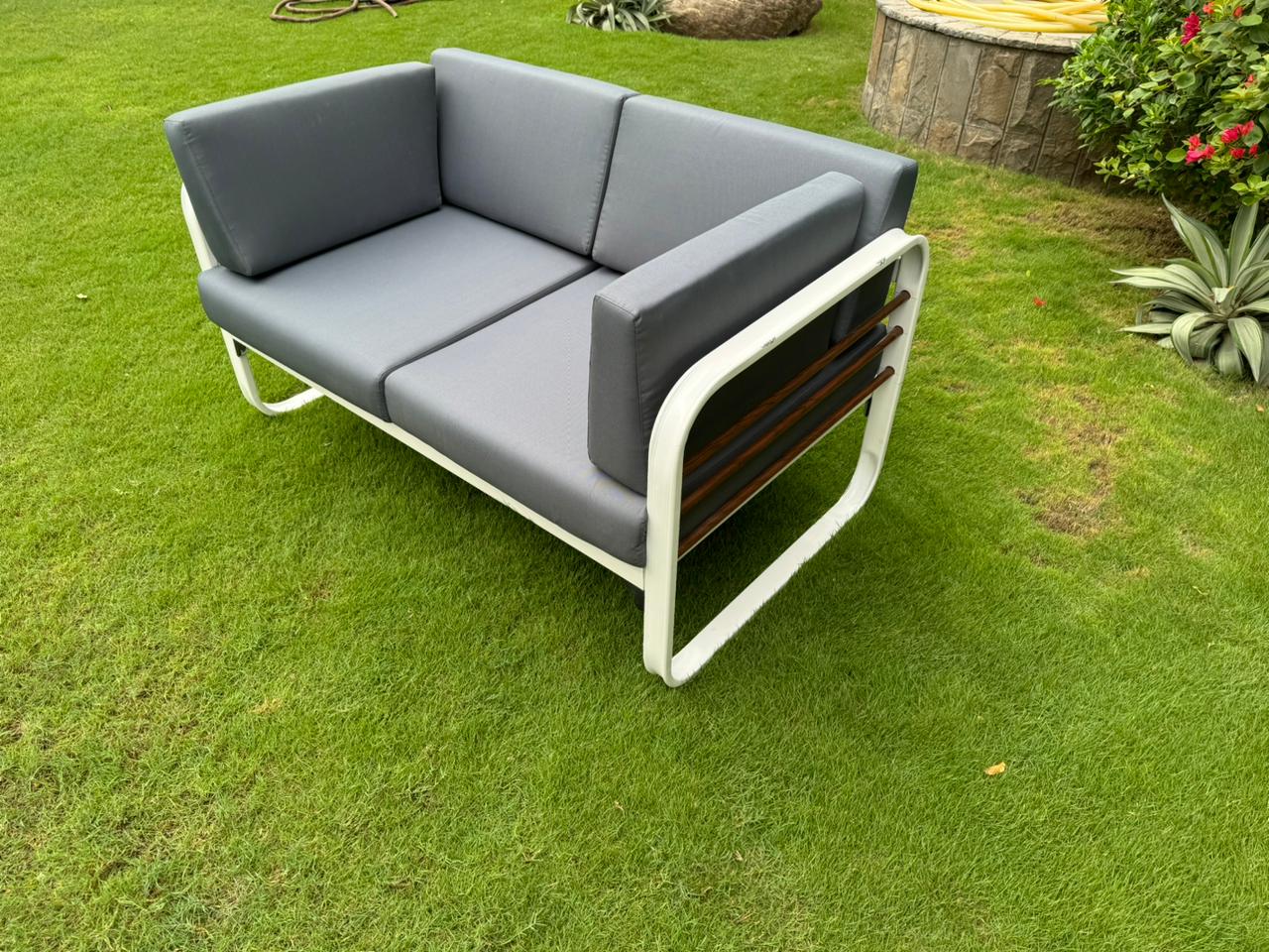 Stylish Nautilus 2 Seater Aluminum Outdoor Patio Sofa featuring a durable aluminum frame and plush, weather-resistant cushions, perfect for outdoor relaxation