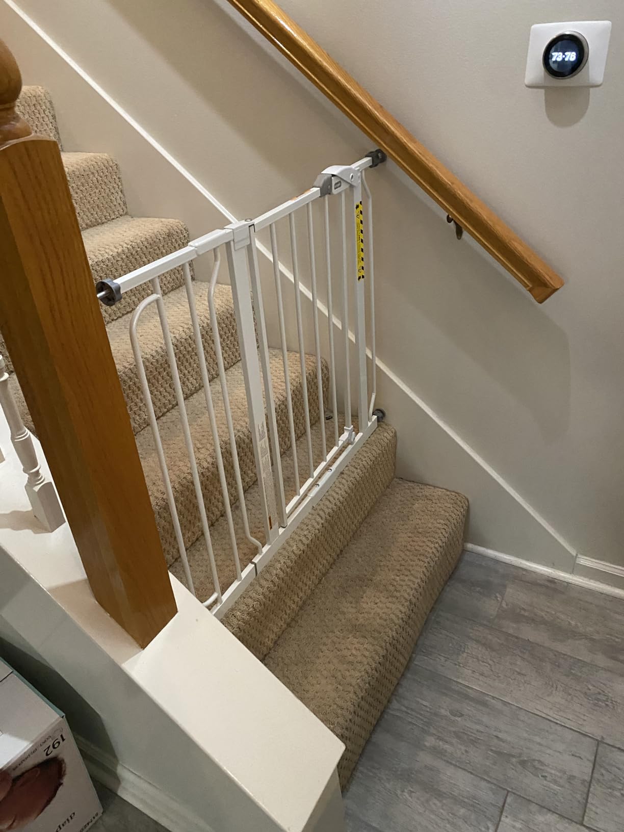 baby gate blocking a staircase to prevent access