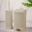 Compact bathroom set with toilet brush holder and pedal bin, ideal for modern, space-saving organization.