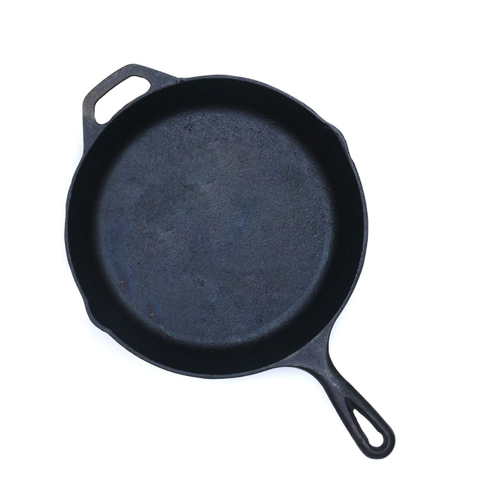 Seasoned 10-inch cast iron skillet for versatile, chemical-free cooking on various heat sources.