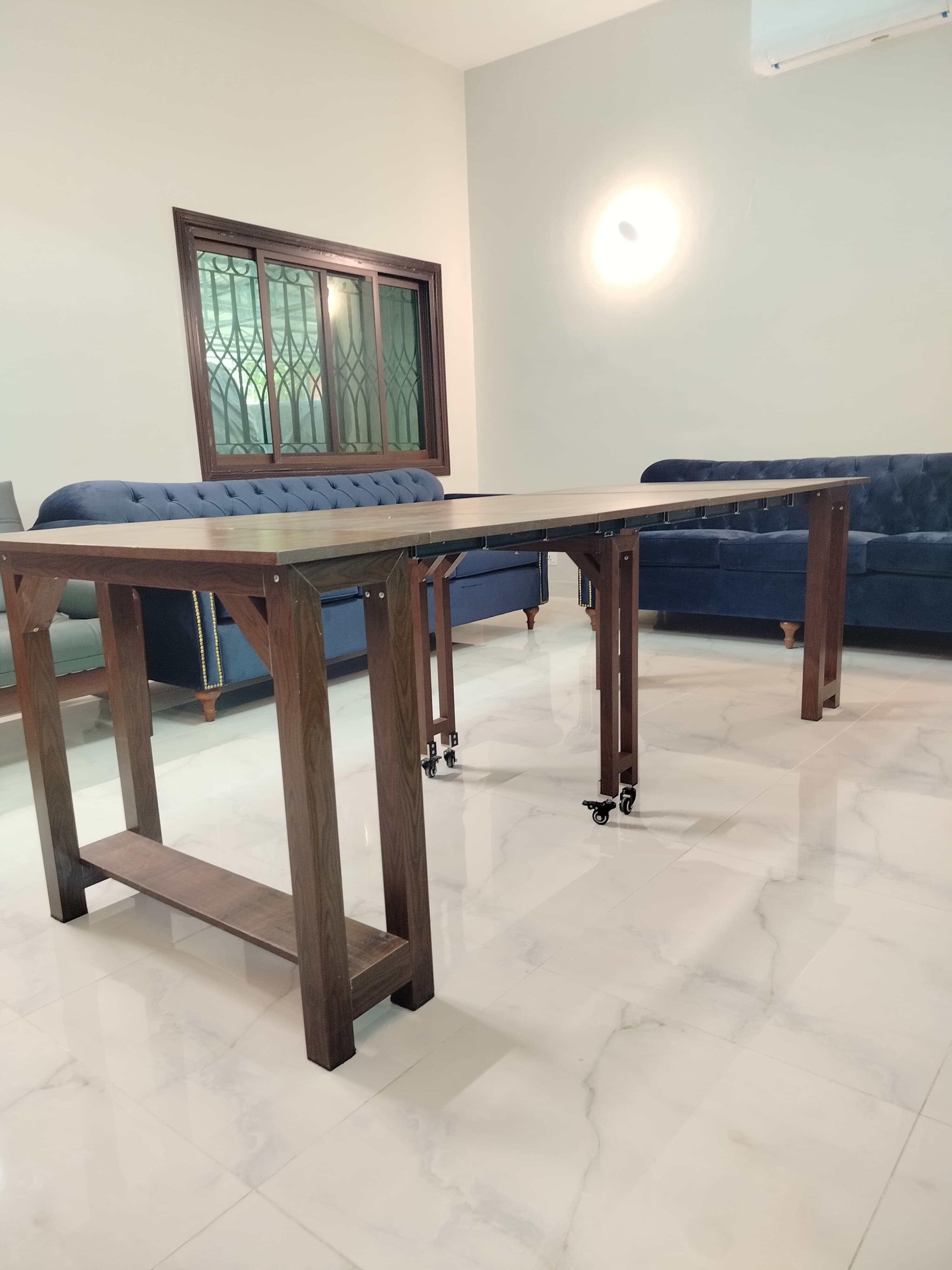 Extendable dining table with aluminum legs and MDF top, adjustable from 36 inches to 8 feet.