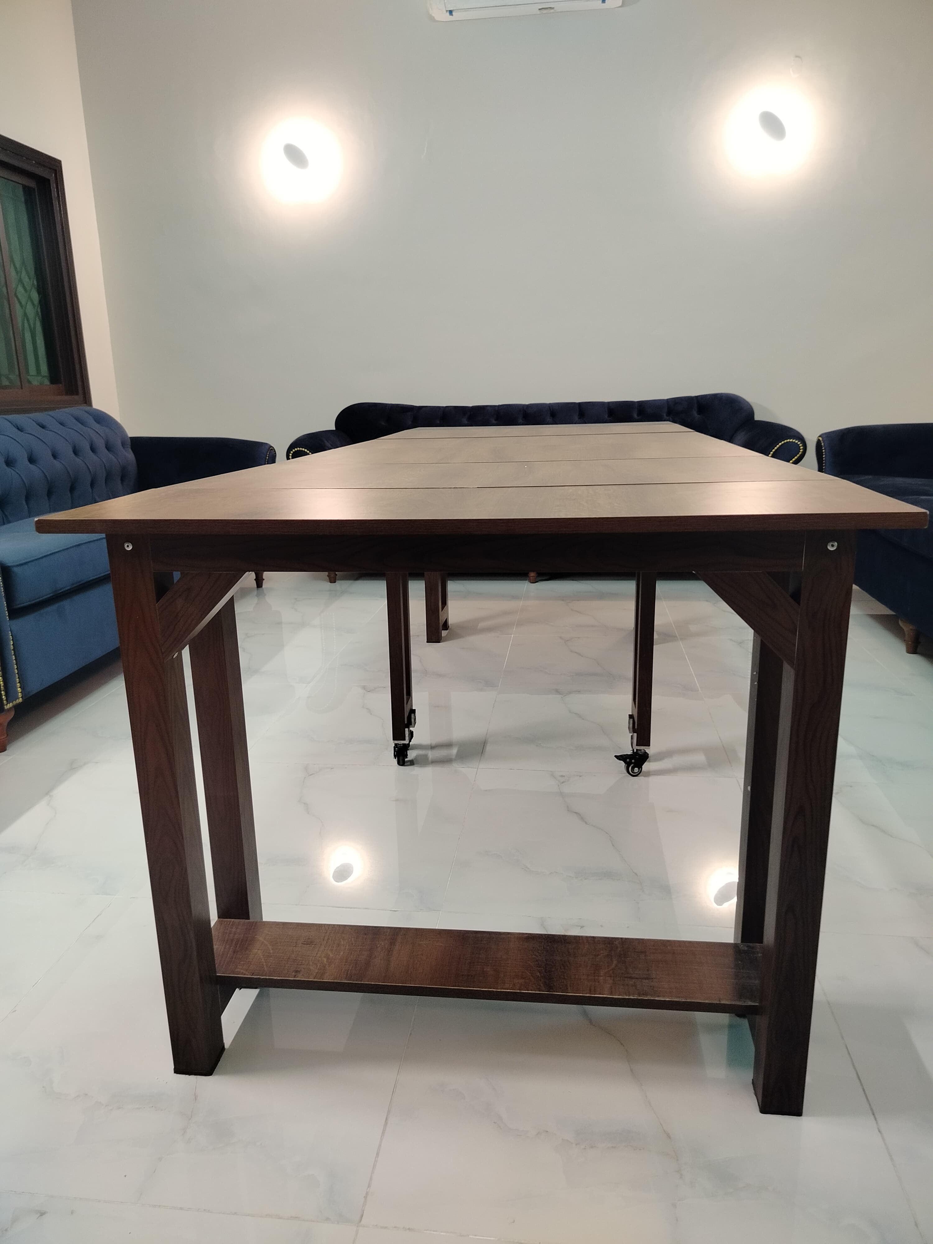 Extendable dining table with aluminum legs and MDF top, adjustable from 36 inches to 8 feet.