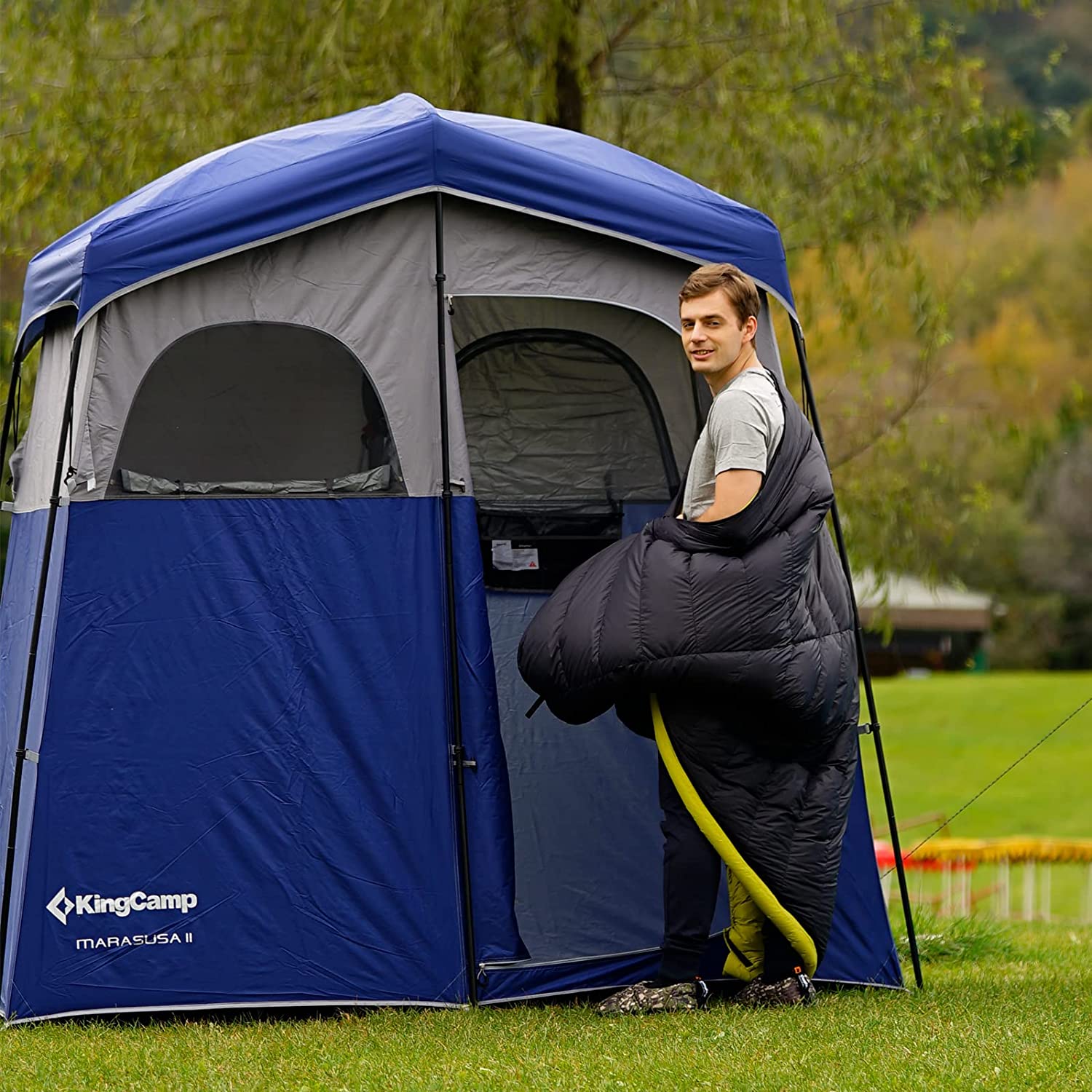 A spacious and durable KingCamp Double Shower Tent with separate rooms for showering and changing, designed for comfort and privacy during outdoor adventures.
