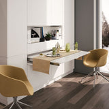 Pull-out peninsula table extending from a drawer compartment.