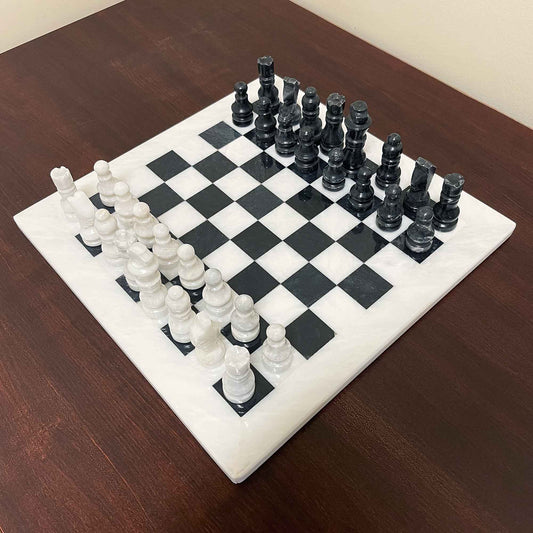 Elegant marble chess board with matching marble chess pieces, featuring a 15x15 inch size. Durable and smart design, ideal for both gameplay and decorative purposes.