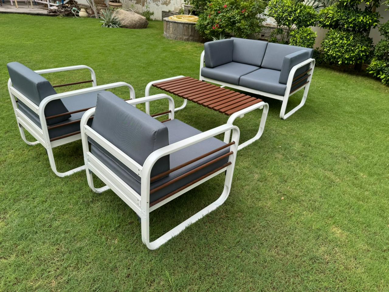 Stylish Nautilus 4 Seater Aluminum Outdoor Patio Sofa Set with a matching Coffee Table, featuring a sleek aluminum frame and plush, weather-resistant cushions, ideal for outdoor gatherings