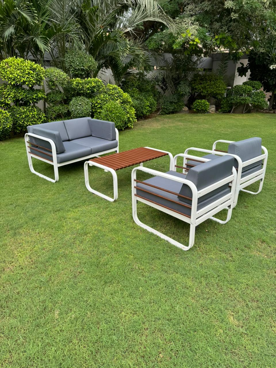 Stylish Nautilus 4 Seater Aluminum Outdoor Patio Sofa Set with a matching Coffee Table, featuring a sleek aluminum frame and plush, weather-resistant cushions, ideal for outdoor gatherings