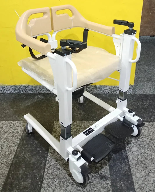 Deluxe patient transfer chair with commode, featuring a white powder-coated steel frame, optional grey or yellow cushion and backrest, steel-coated footplate, and a seat width of 46 cm. Dimensions are 56 cm x 32 cm x 52 cm, designed for easy patient transfer and toileting.