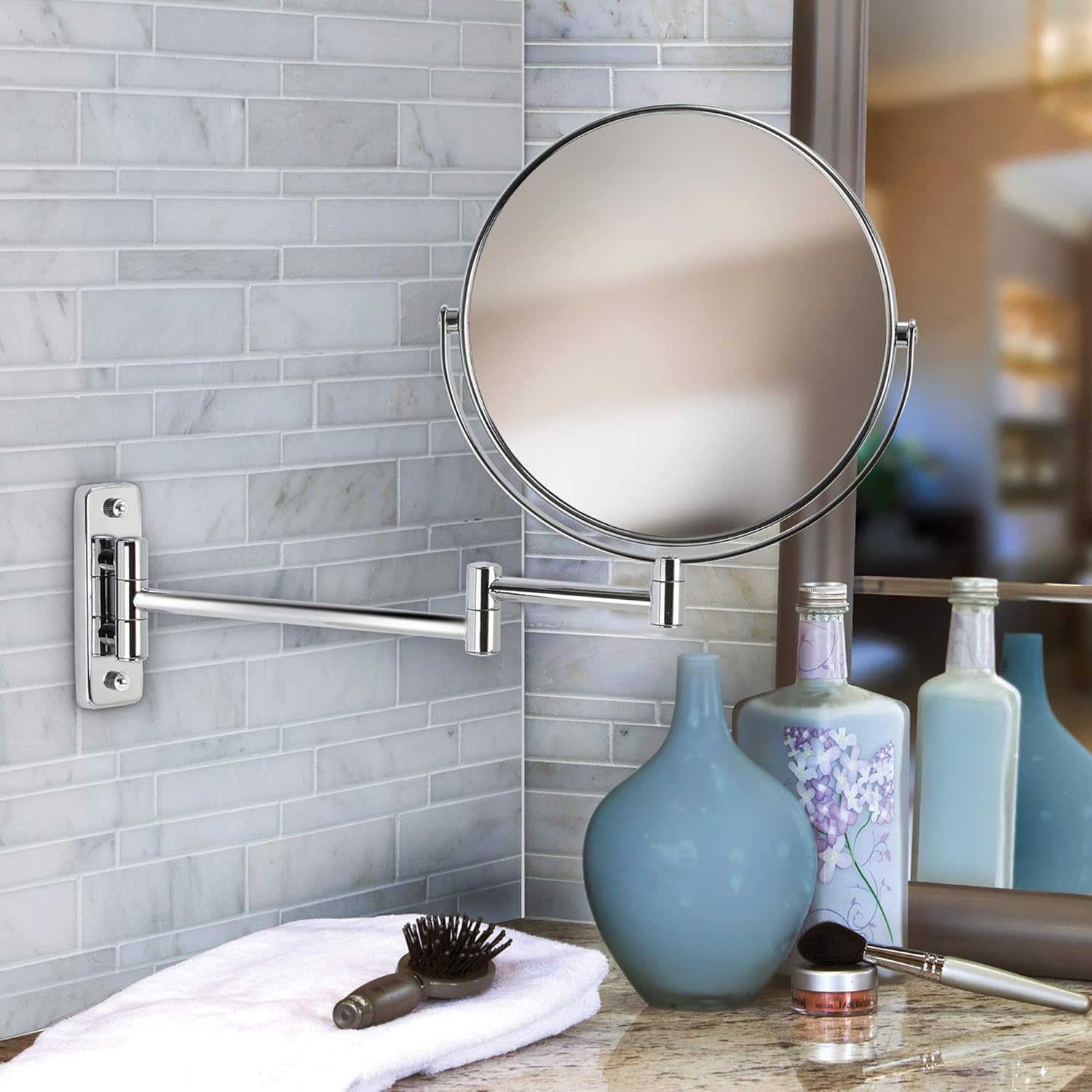 8-inch wall-mounted double-sided cosmetic mirror with chrome finish, featuring a folding arm and 5X magnification on one side for detailed grooming. The arm extends up to 14 inches for flexible positioning.