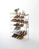 Six-tier shoe rack (34" H) in black, featuring a tall, slim-profile design with space for taller shoes and boots, clip hooks for hanging accessories, and dimensions L 9.84 x W 25.98 x H 34.25 inches, ideal for organized footwear storage