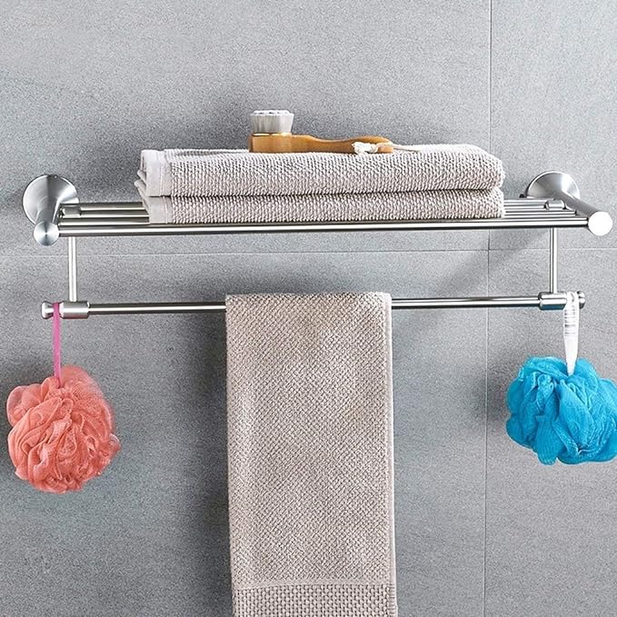 Sleek stainless steel towel shelf for modern bathroom storage.