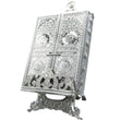 Ornate silver metal Quran holder with an elegant design.