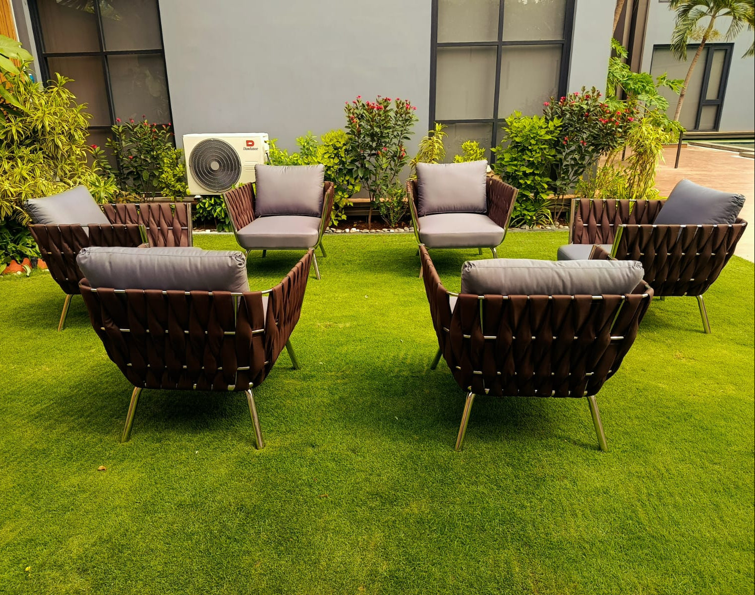 Lusso outdoor furniture collection designed with rounded forms and tapered legs, measuring L68 cm x W68 cm x H61 cm.