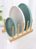 Multifunctional wooden dish rack with multiple slots for drying cups, plates, and pan lids. Made of durable food-grade wood and bamboo, featuring a compact design for easy storage and use. Dimensions: 14x12x11.5 cm