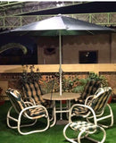 Waterproof garden chair set featuring 4 chairs, 1 table, and 1 umbrella, made from durable PVC-coated fabric for all-weather use."