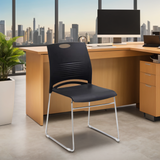 Modern stackable plastic chair available in four colors, perfect for office, training rooms, and dining spaces.