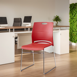 Modern stackable plastic chair available in four colors, perfect for office, training rooms, and dining spaces.