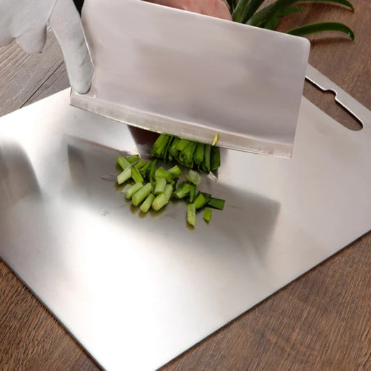 Stainless steel chopping board (33cm x 22cm), made from 100% food-grade, eco-friendly material. Features rounded edges and anti-skid pads for safety. Durable, easy to clean, and knife-friendly, perfect for chopping vegetables, fruits, and meats. Made to order, ready in 15 days.