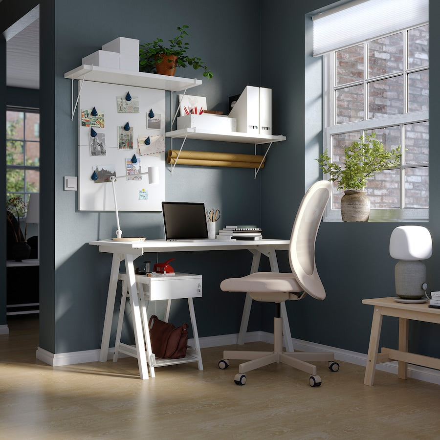 TROTTEN white desk measuring 120x70 cm with sleek A-shaped legs, designed to fit in small spaces and maximize under-desk storage for a chair and other items.