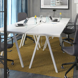 TROTTEN white desk measuring 120x70 cm with sleek A-shaped legs, designed to fit in small spaces and maximize under-desk storage for a chair and other items.