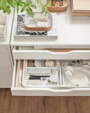 A white drawer unit on casters, measuring 26 3/8x26 inches, featuring multiple drawers for organized storage. Ideal for home offices or craft spaces, it combines mobility with modern design, making it easy to keep essentials accessible and your space clutter-free.